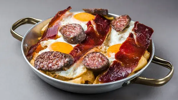 French Fries with egg, sausage and cured beef